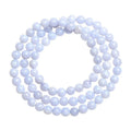 Blue agate bracelet with scattered beads pattern and a Ruyi charm on a white background.