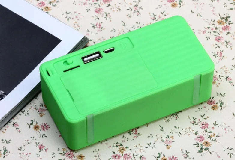 Cannon X3 portable mini cube Bluetooth speaker in five colour options: black, blue, green, red, yellow.