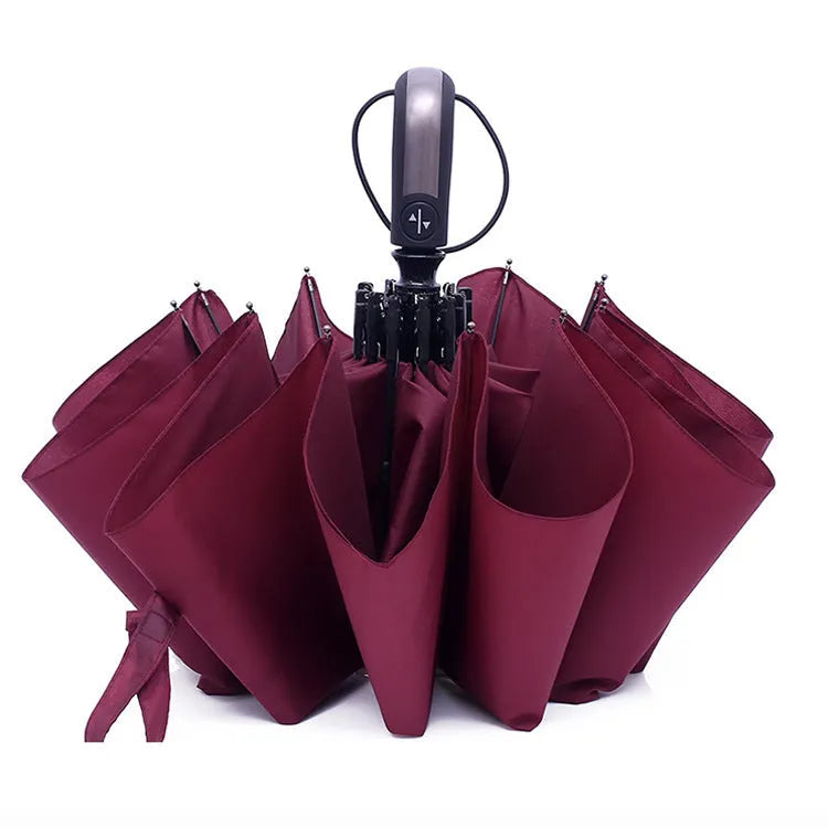 Black triple folding business umbrella with automatic opening mechanism and steel ribs