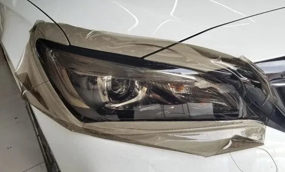 30cm wide plastic car lamp protective film on LED headlight showing transparent protection