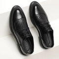 Men's pointed British style black dress shoes with rubber sole for formal wear