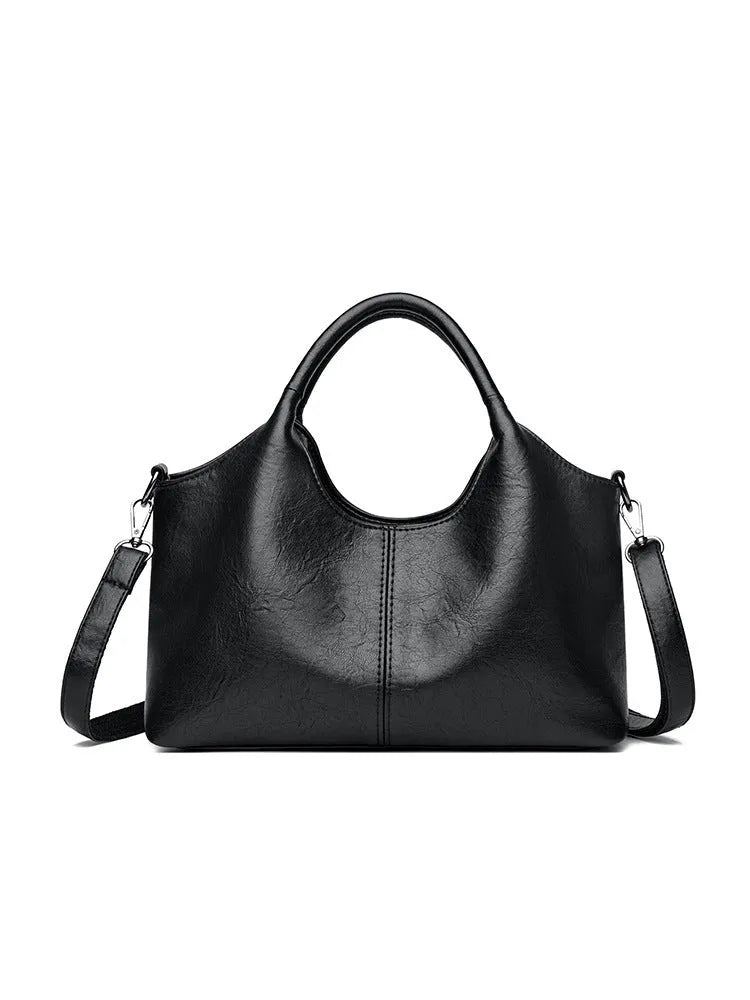 Genuine leather women's cross-body bag in black with soft texture and large capacity design
