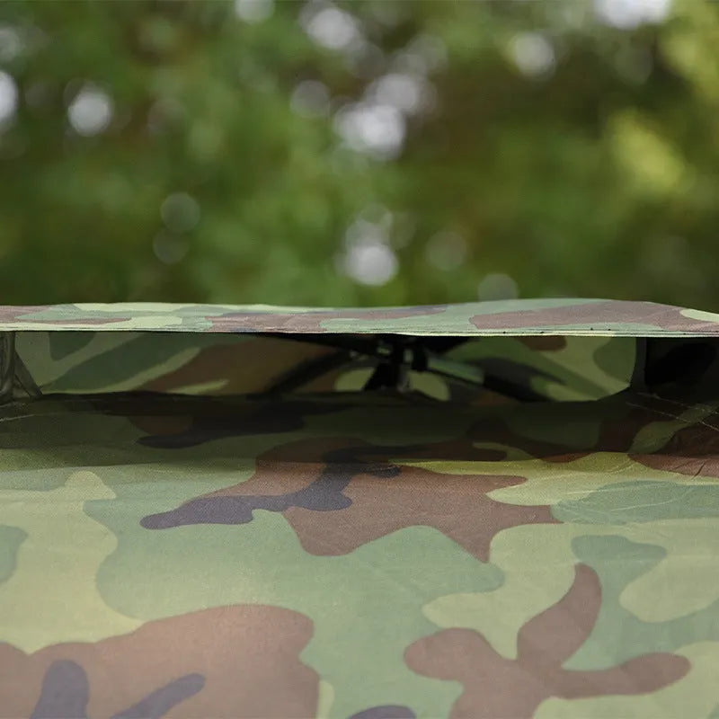 Green camouflage two-person camping tent with mesh windows and steel ground nails