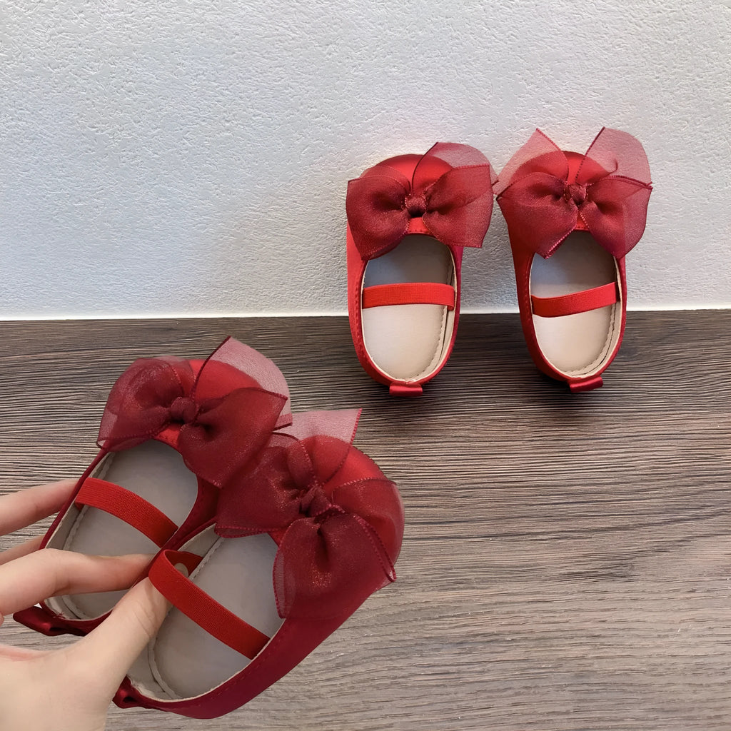 Princess toddler soft bottom pumps in festive red with bow pattern real silk upper elastic band closure
