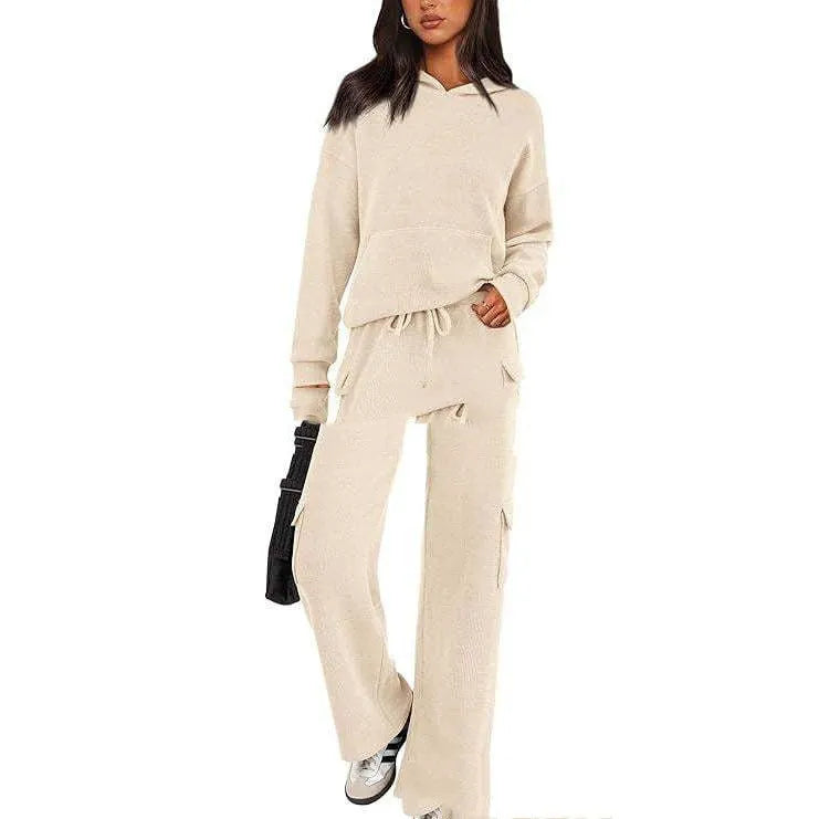 Women's polyester leisure sports suit set showing long sleeve top and matching trousers in multiple colour options