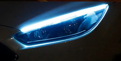 Flexible silicone car LED daytime running light strip with flowing turn signal animation mounted on headlight.