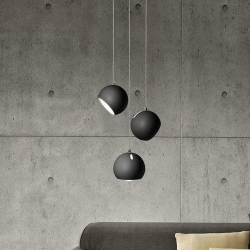 Post-modern ball chandelier table lamp in Moon White or Obsidian Black finish.