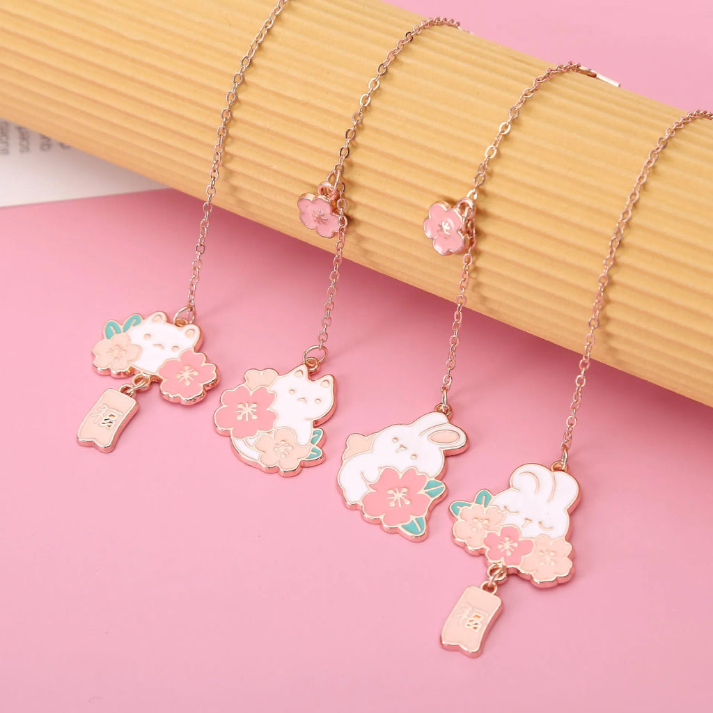 Metal pendant bookmark with cherry blossom cartoon cat design and matching book holder