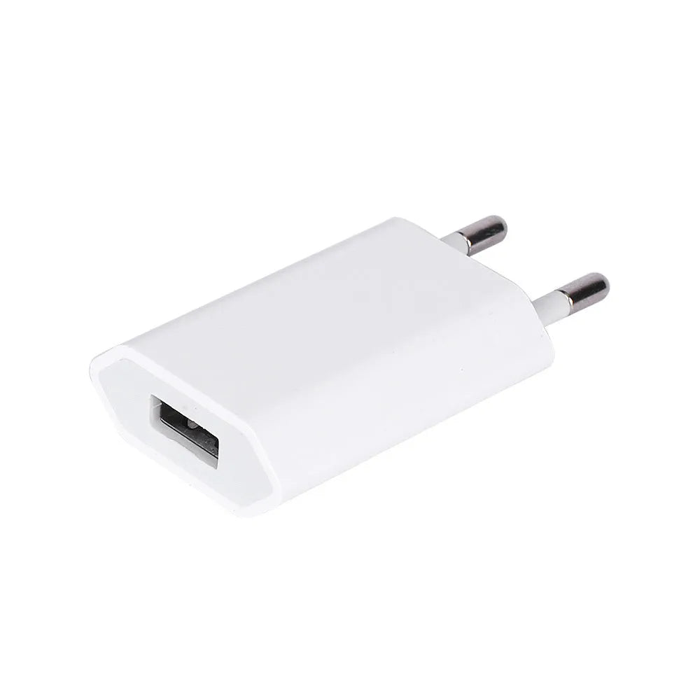 White USB wall charger and white Lightning cable for iPhone and iPad charging.
