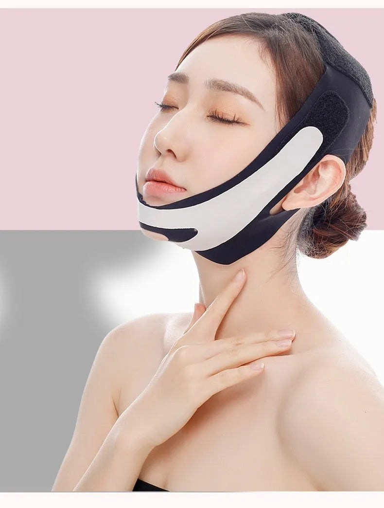 Pink and black elastic V-shaped face bandage for facial contouring, shown with full English box packaging.