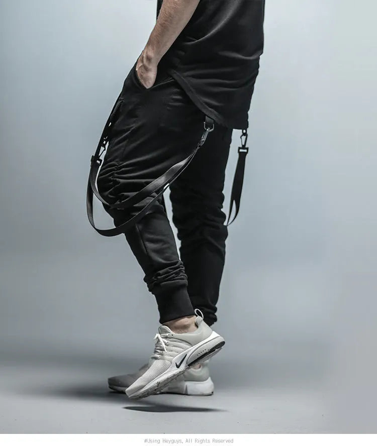 Men's black cotton blend pencil sweatpants with belt, flat lay showing tapered leg and waist elastic