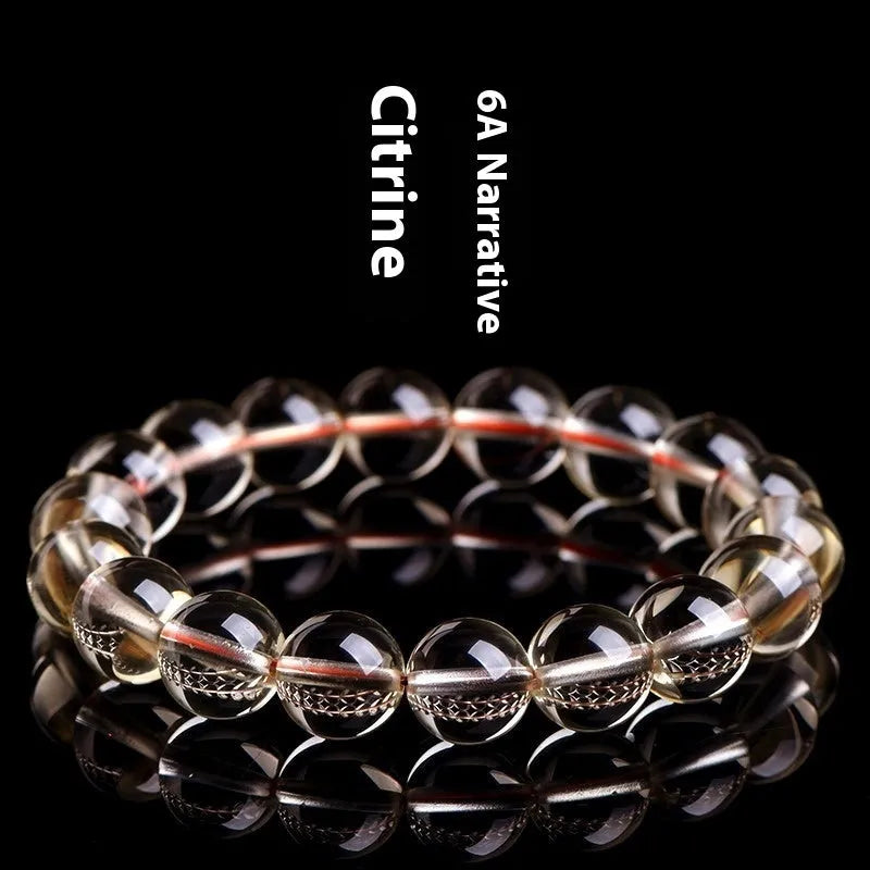 Natural citrine scattered beads ball bracelet showing polished gemstone beads on a wrist.