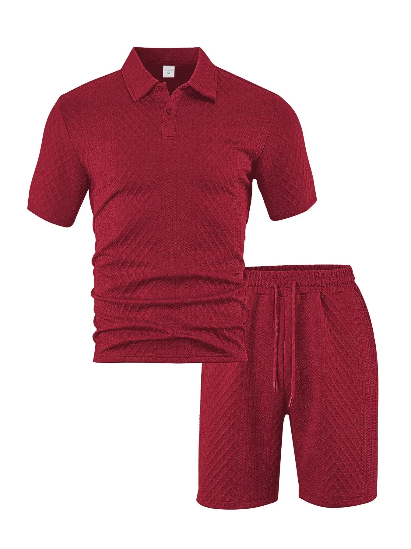 Men's patterned cloth casual suit set featuring a short sleeve polo shirt and trousers on a hanger.