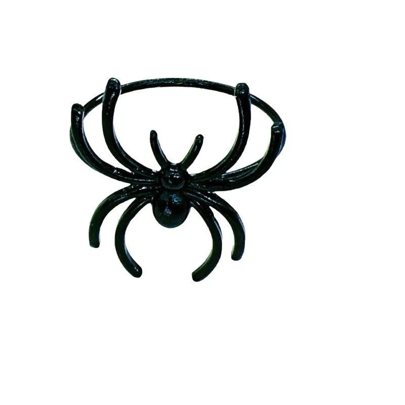 Six black metal spider napkin rings for Halloween table decoration