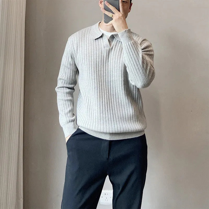 Man wearing a loose-fit Army Green knitted pullover sweater with long sleeves.