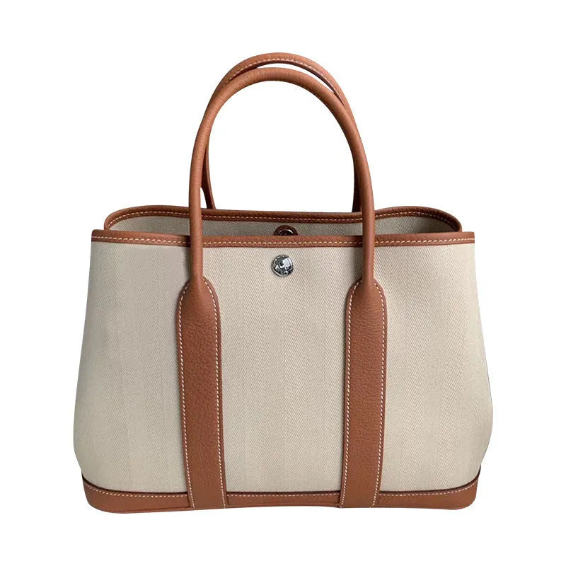 Genuine leather crossbody bucket tote bag with canvas surface in multiple colour options