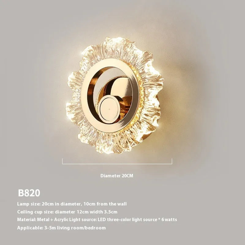 Modern minimalist bedroom wall lamp with a white acrylic shade on a wall.