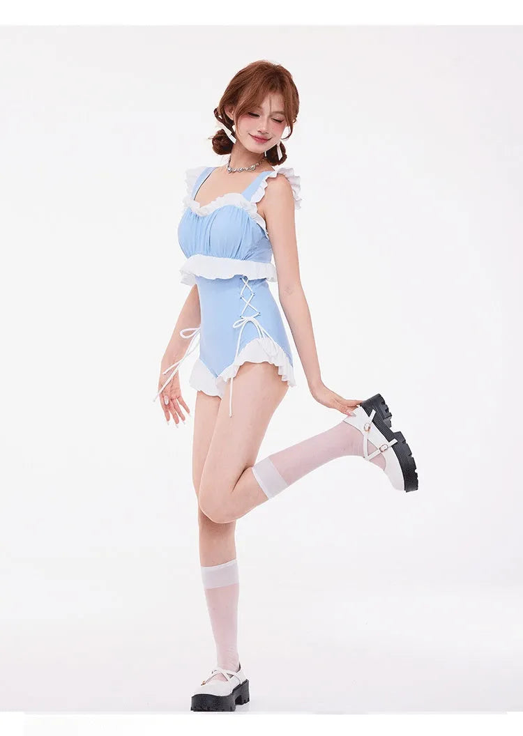 Light blue high-waist, backless one-piece swimsuit with lace detailing on the chest.