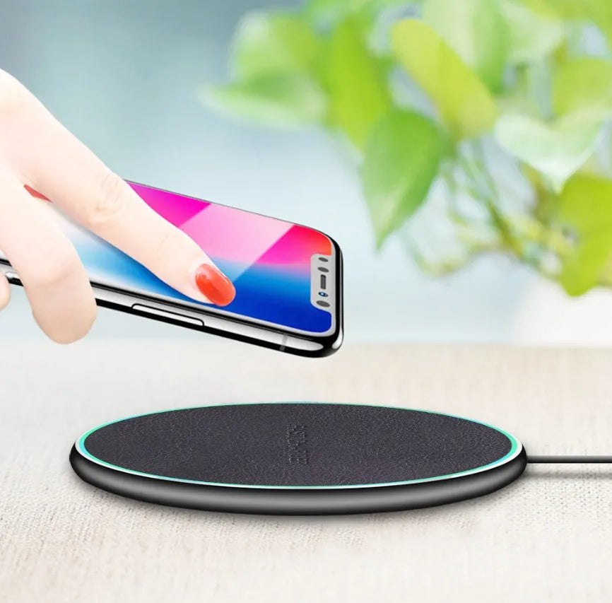 Black Quick Qi wireless charging pad for iPhone 11 and Android phones with LED indicator