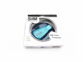 Blue external USB 2.0 SIM card reader for mobile phone data backup and transfer on a desk
