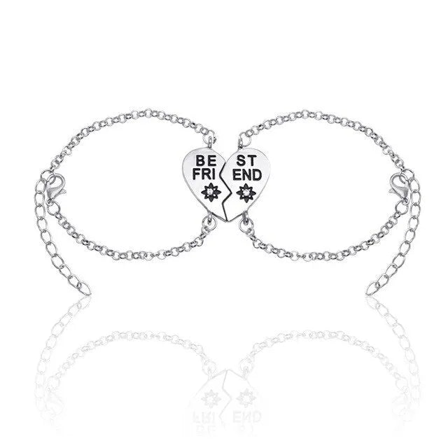 Heart shape alloy bracelet with dripping oil finish and inlaid gems in gold and silver colours