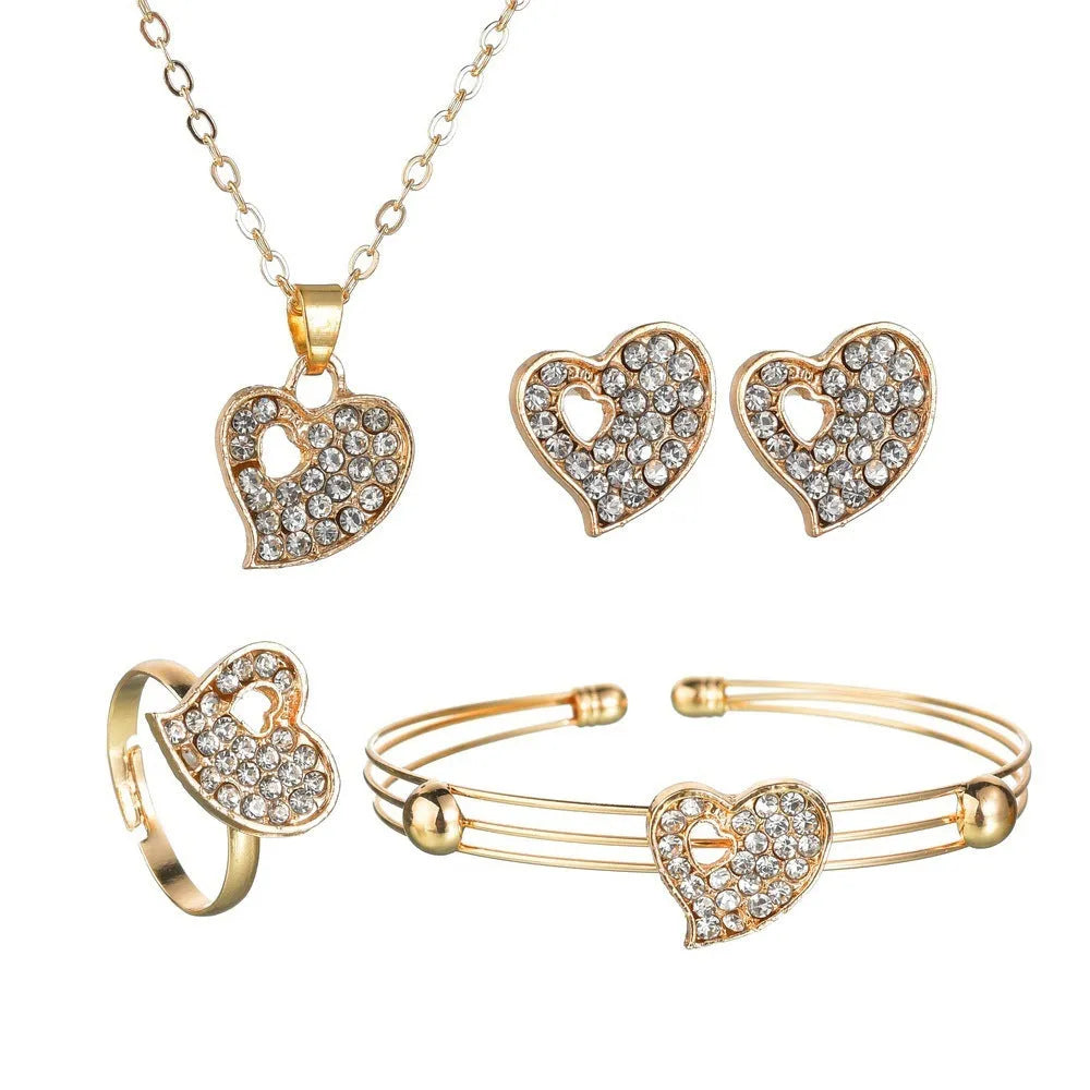 Gold-tone women's jewellery set with adjustable necklace, earrings, and hand decoration featuring love heart pendant