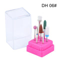 Set of seven tungsten steel nail drill bits and a brush in a transparent plastic storage case.