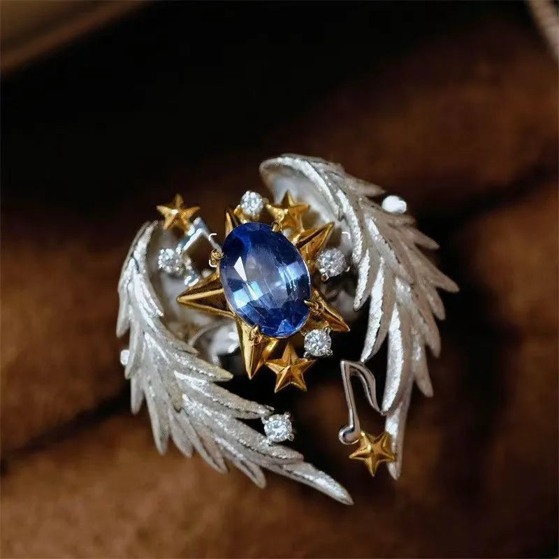 Adjustable geometric alloy ring with open mouth design and oiled finish