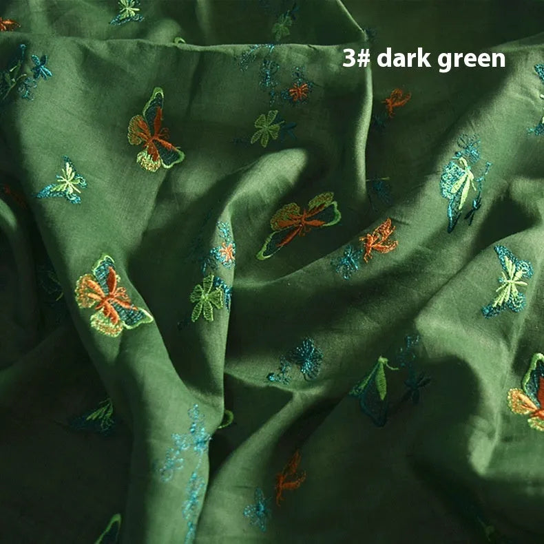 100% ramie embroidery fabric showing texture in beige, dark green and grass green colours
