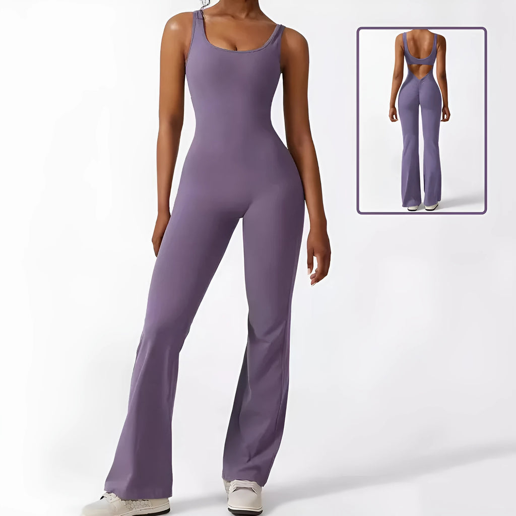Woman wearing a sleeveless flare-leg jumpsuit for yoga in Army Green, showcasing the fashionable waist and full length.