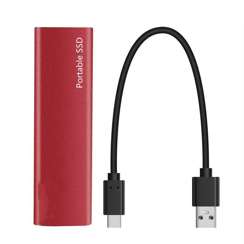 Red ultra-thin metal external SSD hard drive with high storage capacity on a desk.