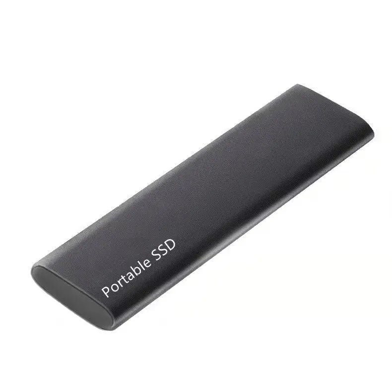 Red ultra-thin metal external SSD hard drive with high storage capacity on a desk.