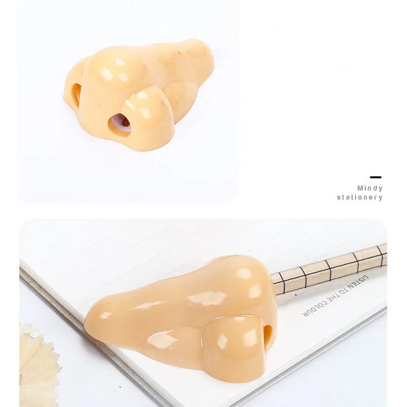 Flesh-coloured geometry-shaped pencil sharpener with big nostril design measuring 58x45x30mm
