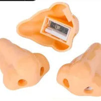 Flesh-coloured geometry-shaped pencil sharpener with big nostril design measuring 58x45x30mm