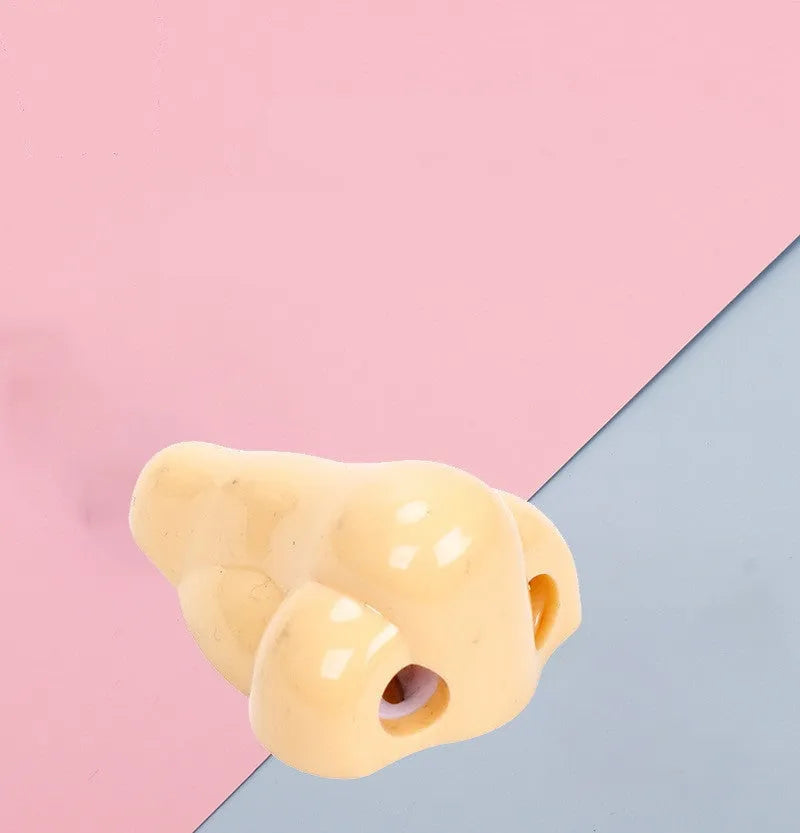 Flesh-coloured geometry-shaped pencil sharpener with big nostril design measuring 58x45x30mm