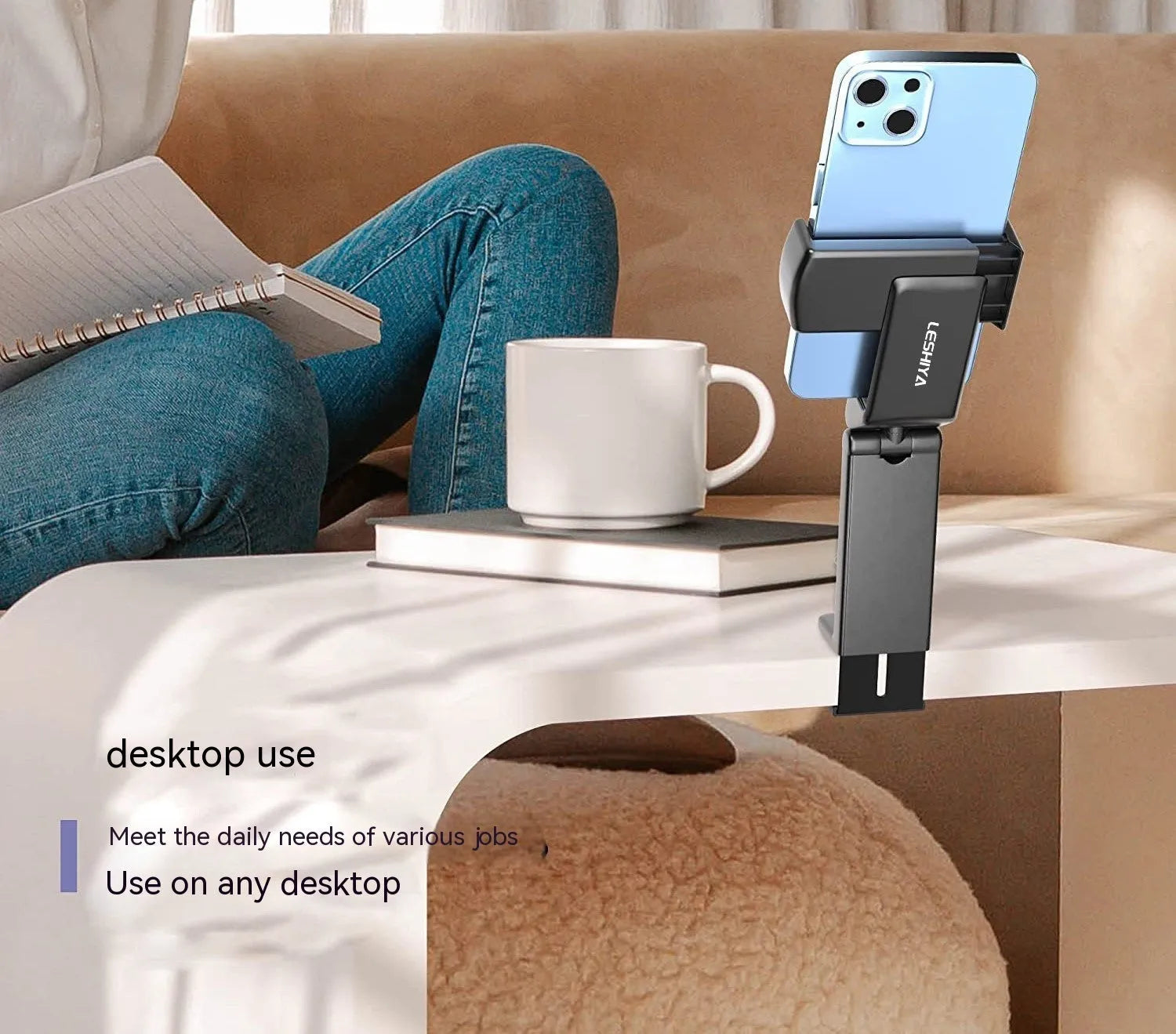 Foldable rotating universal phone holder in black, shown in an open position holding a mobile phone.