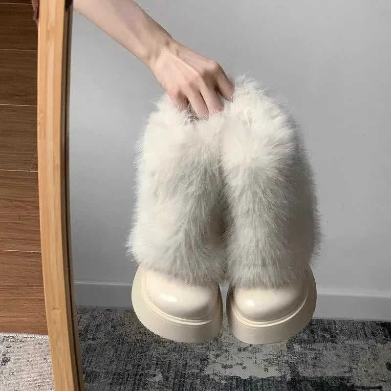 Women's black fleece-lined snow boots with rubber sole and mid heel