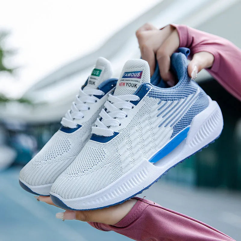 Men's blue casual sports shoes with cloth mesh upper and round toe design on a white background