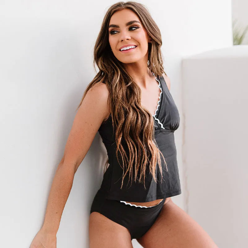 Black women's one-piece split swimsuit or bikini set made from nylon fabric.