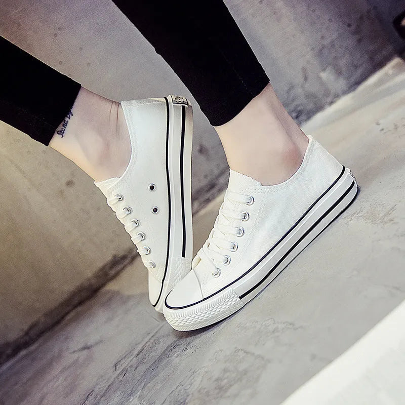 Women's solid colour casual canvas shoes in lace-up style on a white background.