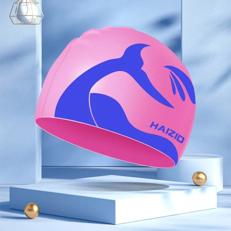 Silicone swimming cap with waterproof ear protectors featuring whale tail pattern design