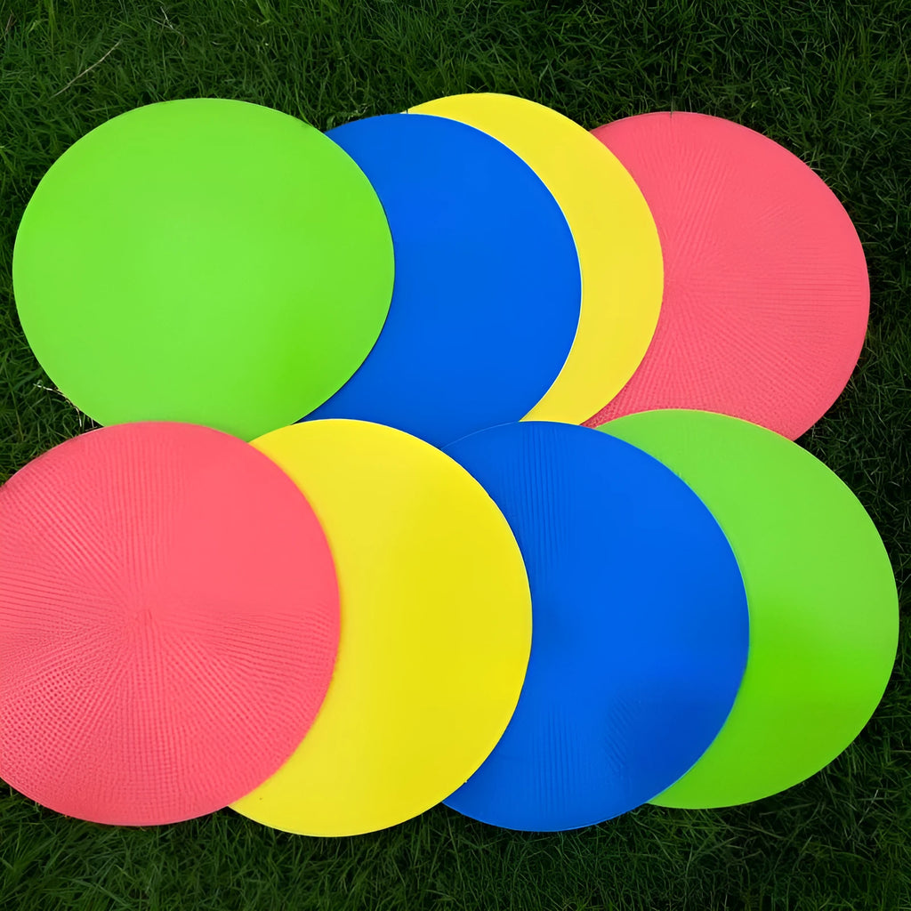 Soft yellow TPE football training landmark pad on grass, showing 23cm diameter.