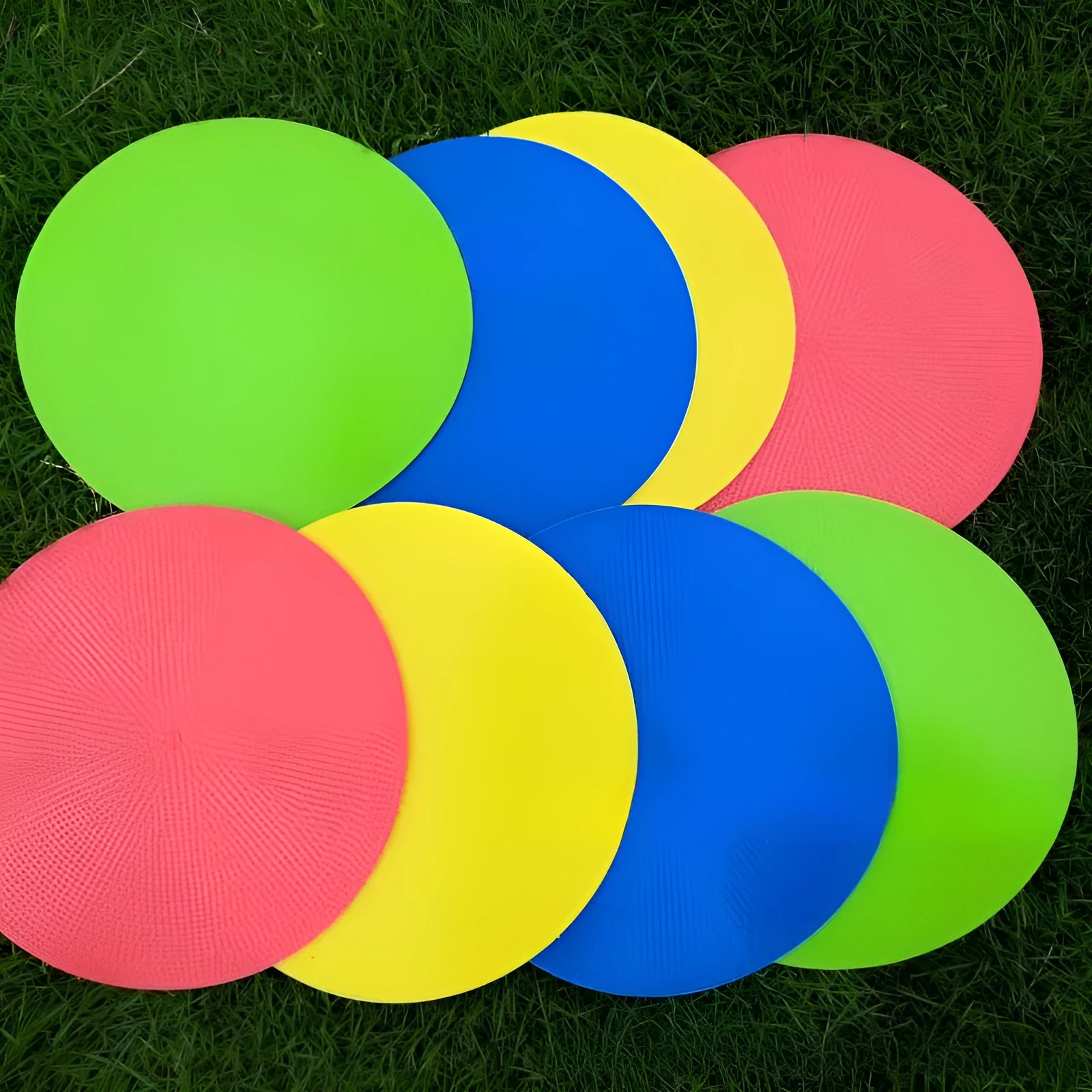 Soft yellow TPE football training landmark pad on grass, showing 23cm diameter.