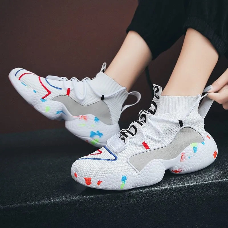 Men's camouflage pattern sneakers with mesh upper and vulcanised rubber sole on a white background.