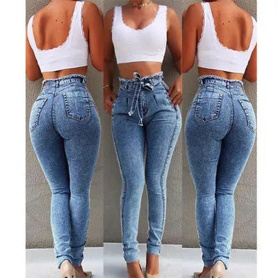 Women's fringed jeans in cowboy denim fabric showing decorative leg fringing detail