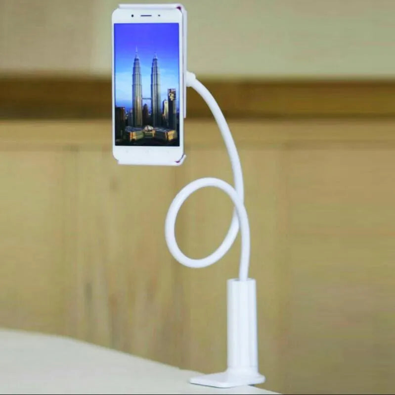 Black bedside oversize flat panel phone holder with a long flexible arm mounted on a table.