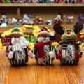 Red, green, and white flannel Christmas snowman decoration measuring 18cm by 13cm.