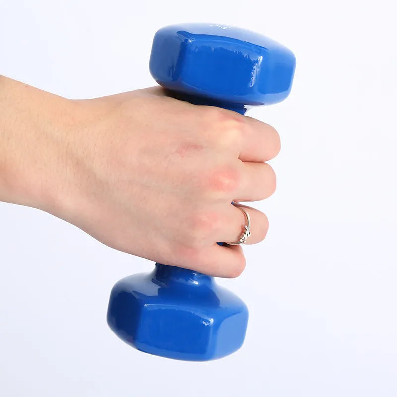 Colourful plastic fitness dumbbells in bright colours with glossy surface for home exercise