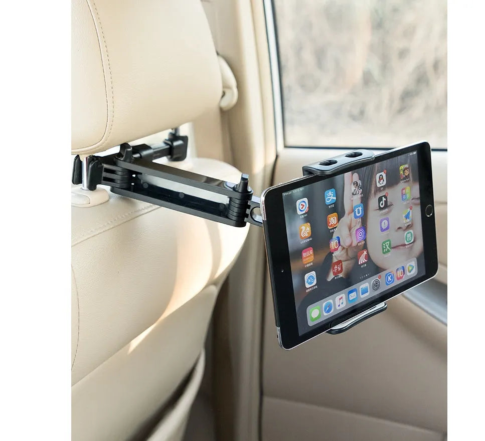 Black car phone holder mounted on rear seat headrest with tablet securely positioned