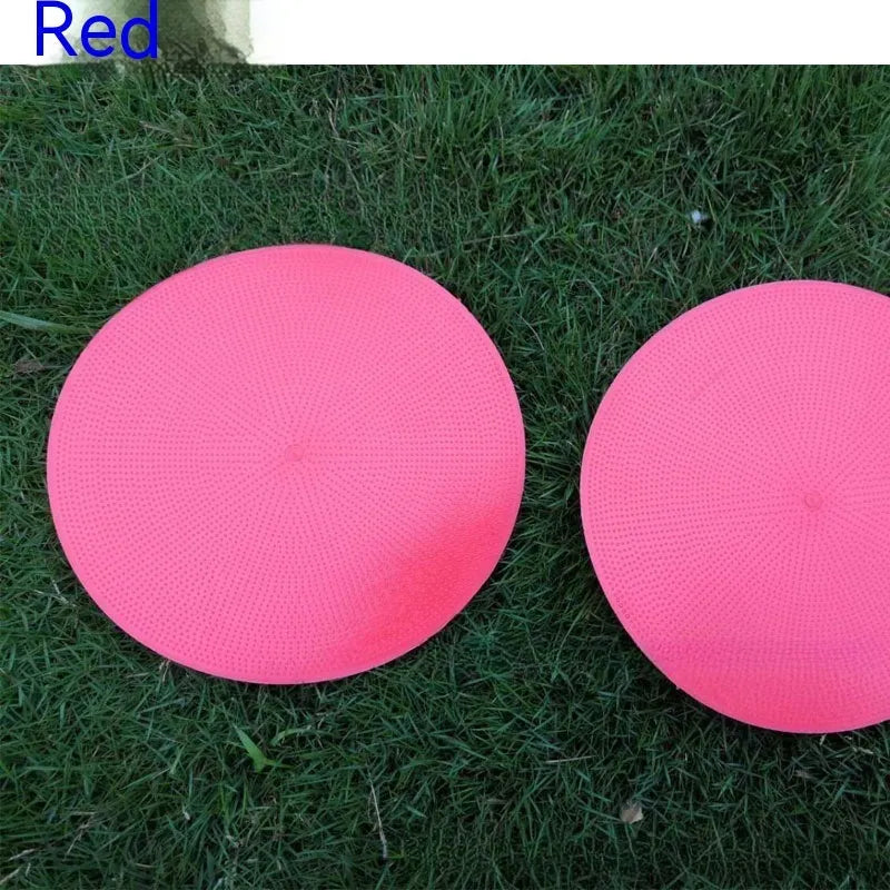 Soft yellow TPE football training landmark pad on grass, showing 23cm diameter.
